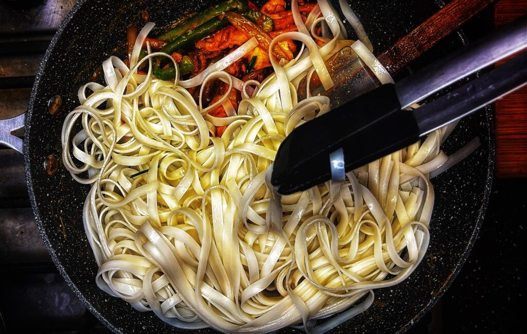 Add the Pad Thai noodles to the base, protein and veggies